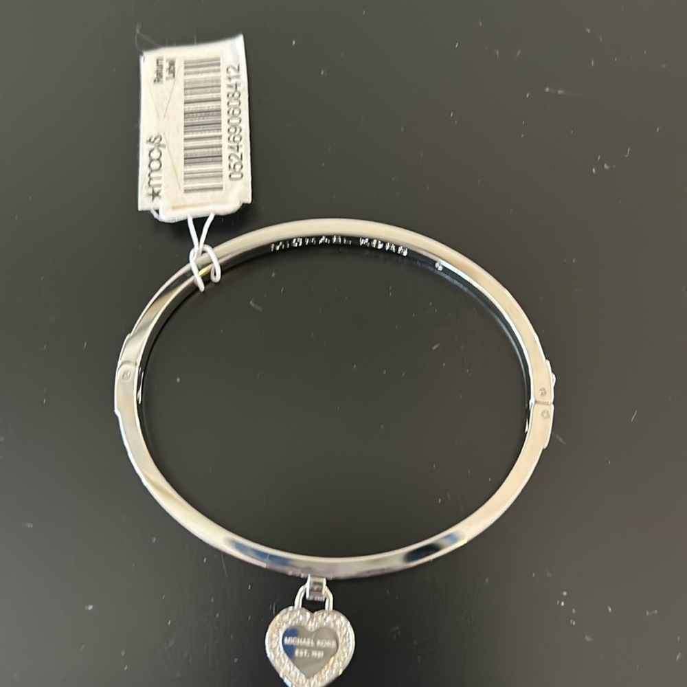 Silver tone Michael Kors heart pendant bangle bracelet